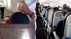 Passenger's bizarre use of drinking glass on flight leaves travelers horrified Adelaide Schools